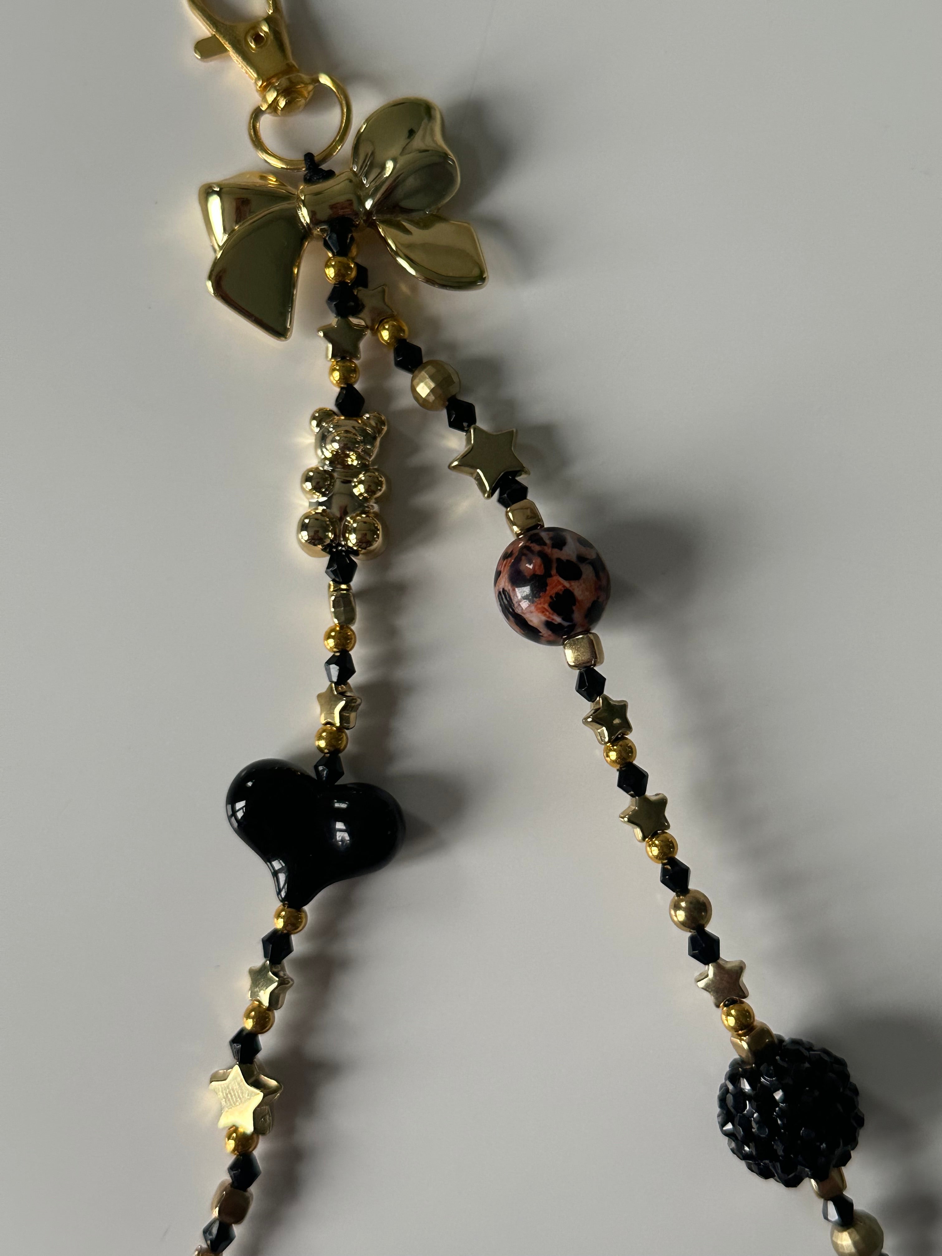 Black ‘n’ gold bag charm