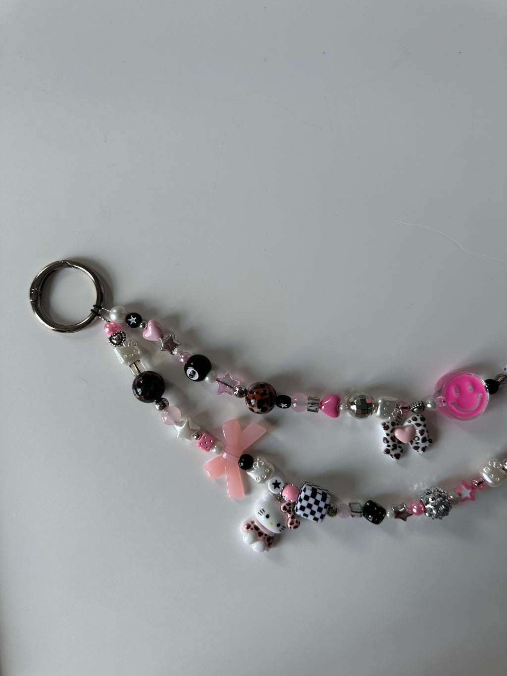 Hello Kitty bag charm (pink smiley)