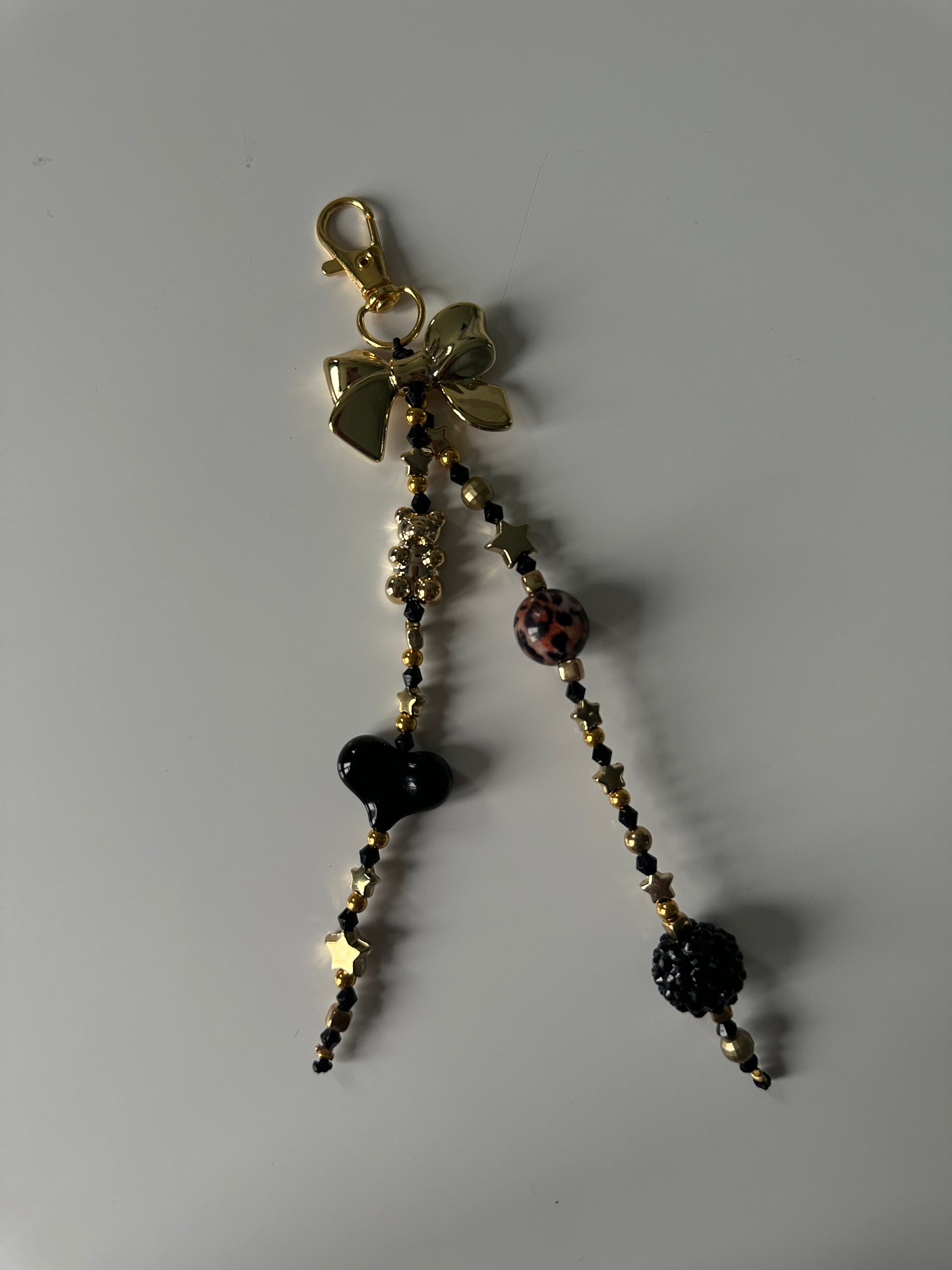 Black ‘n’ gold bag charm