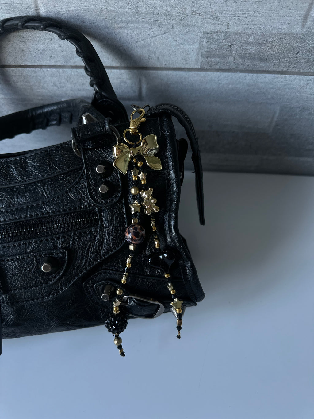 Black ‘n’ gold bag charm
