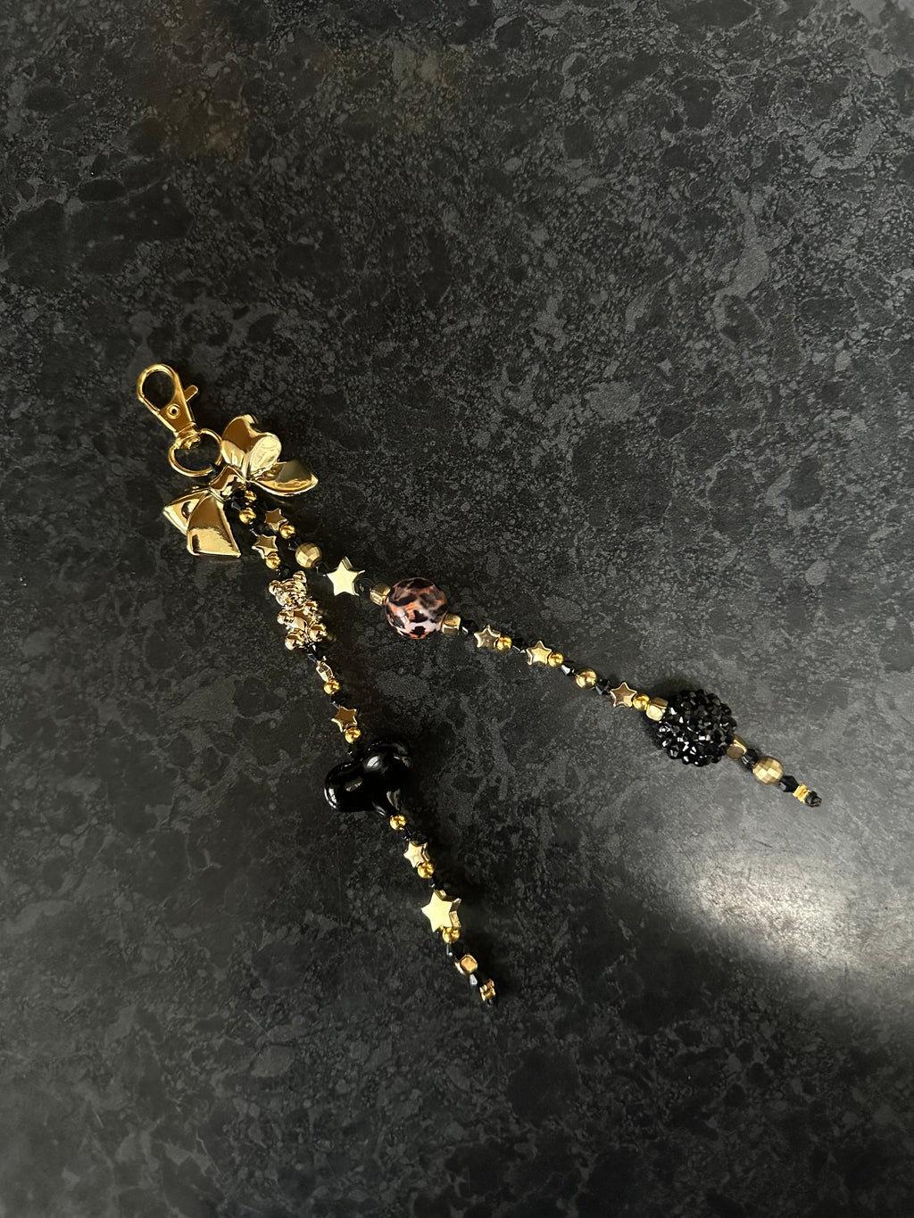 Black ‘n’ gold bag charm