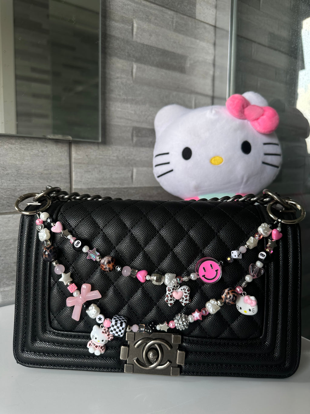 Hello Kitty bag charm (pink smiley)