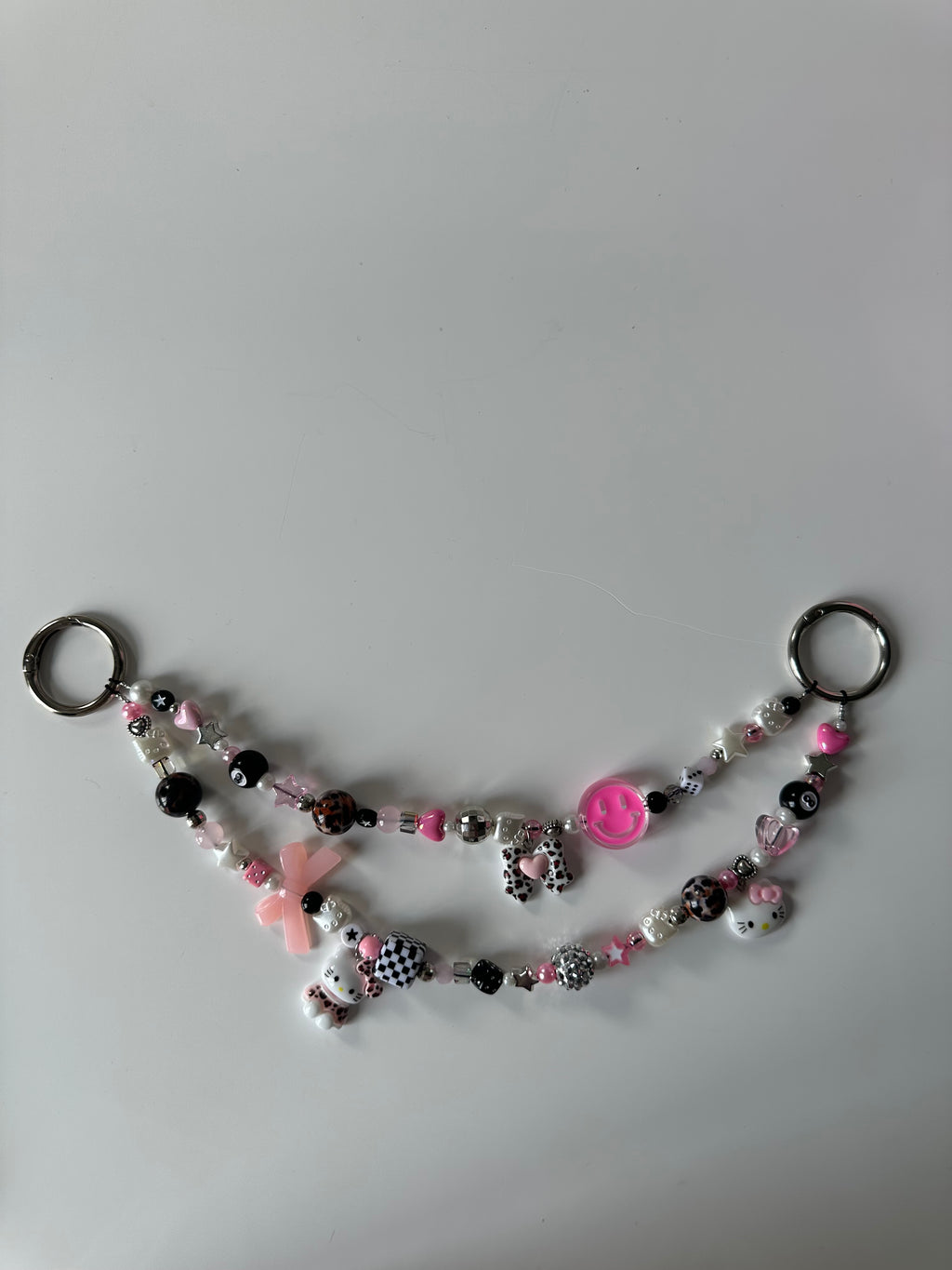 Hello Kitty bag charm (pink smiley)