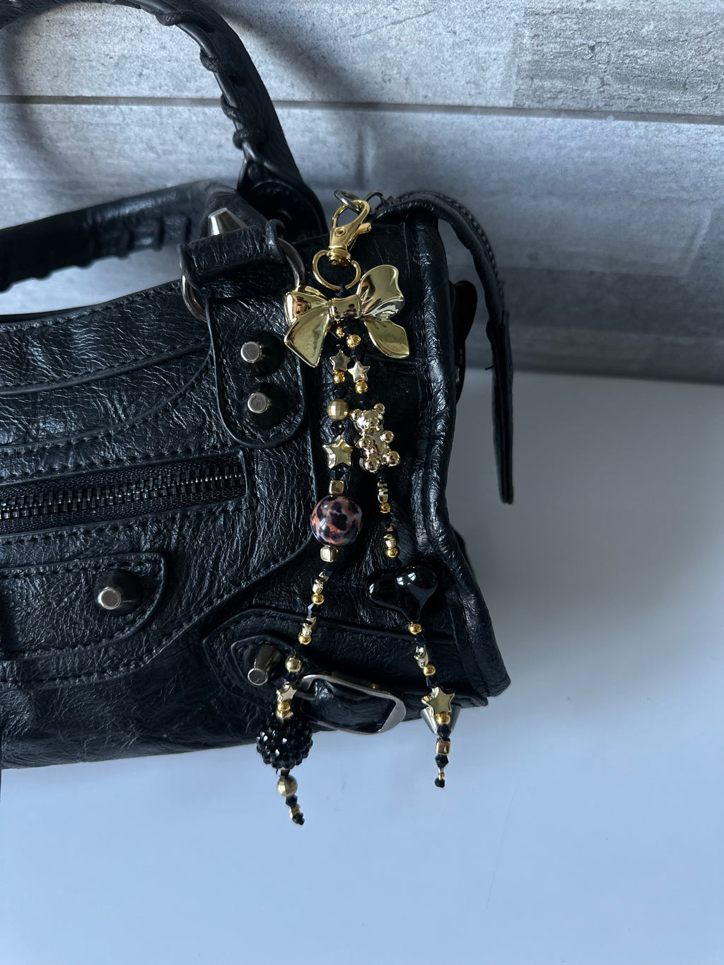 Black ‘n’ gold bag charm