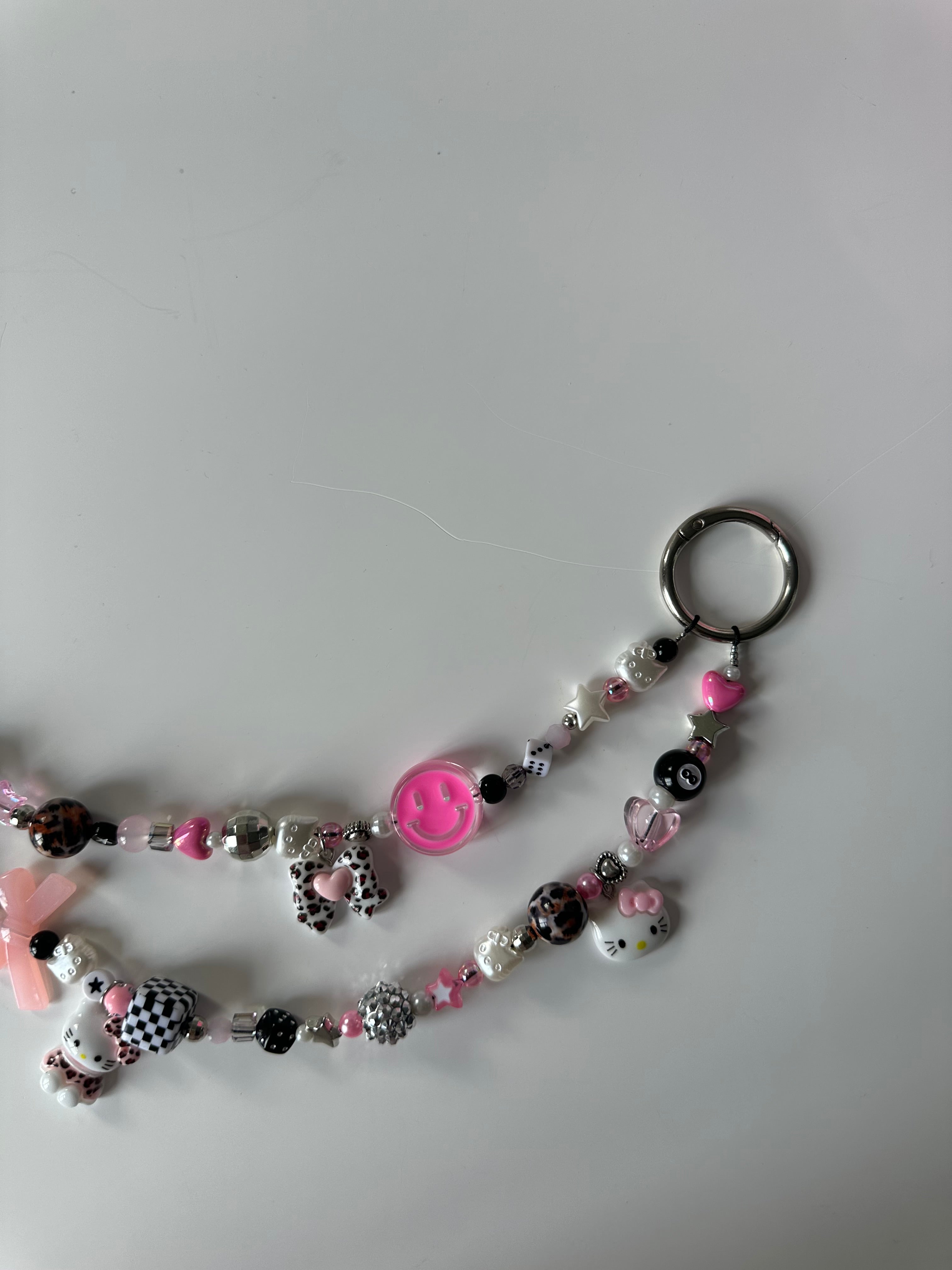 Hello Kitty bag charm (pink smiley)