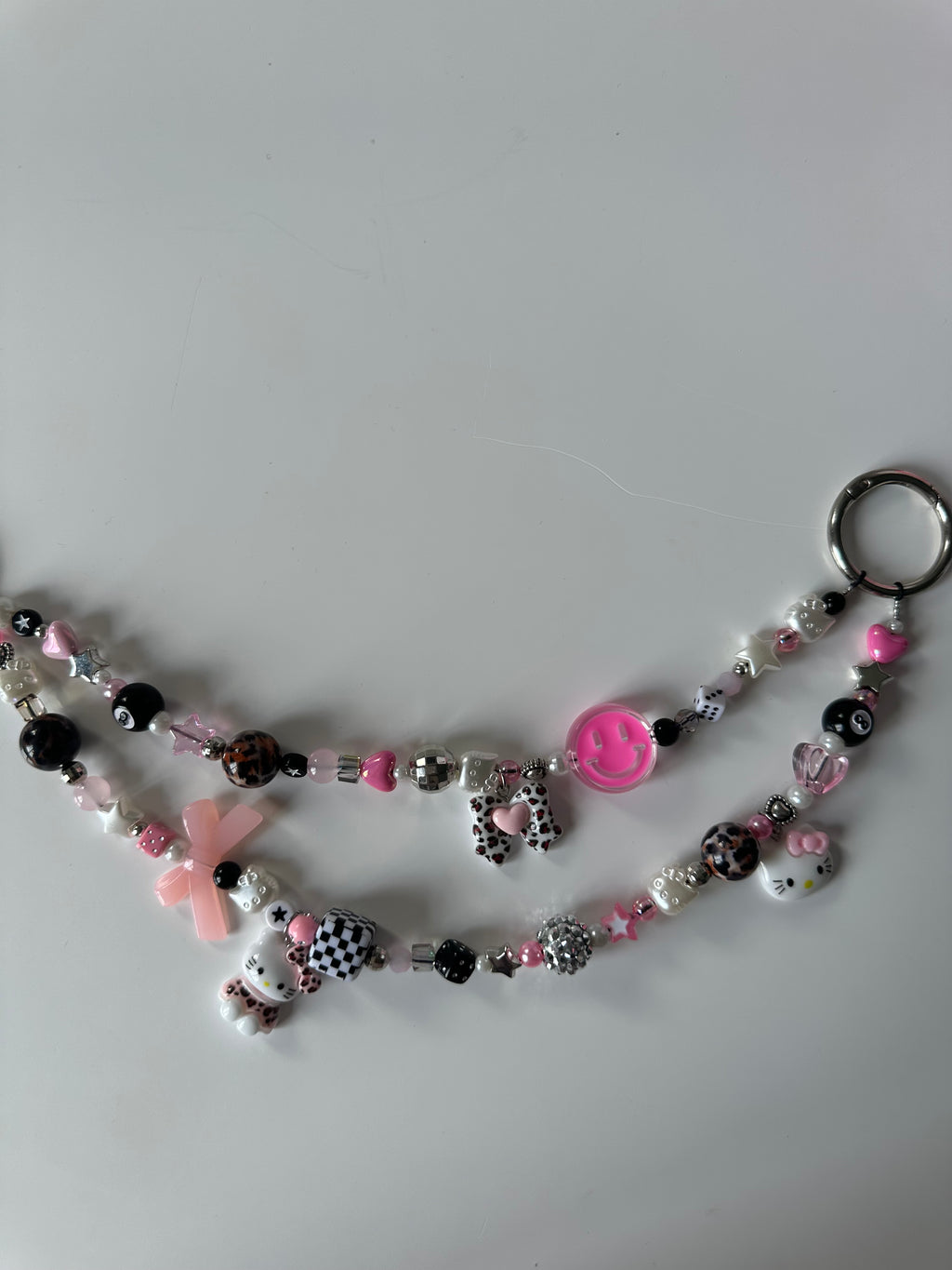 Hello Kitty bag charm (pink smiley)