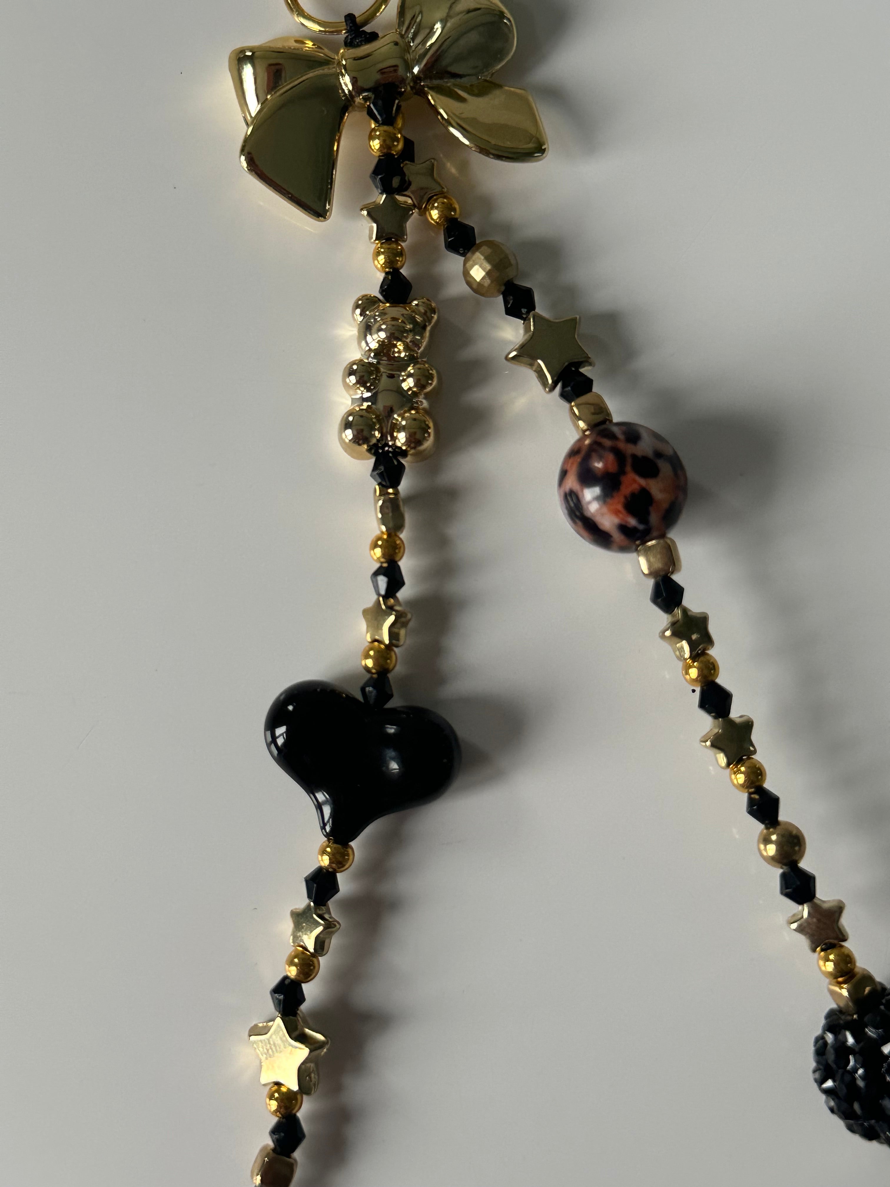 Black ‘n’ gold bag charm