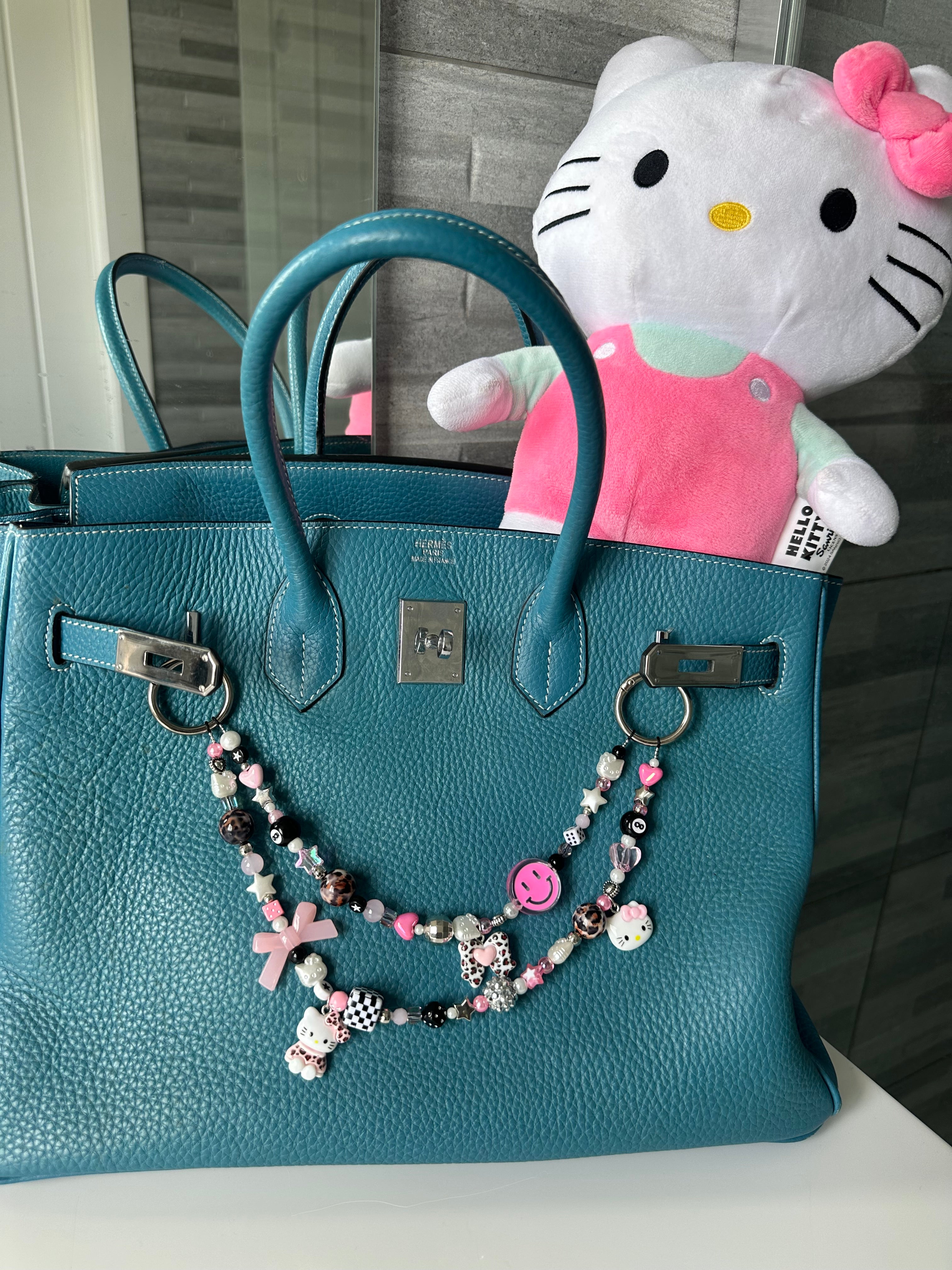 Hello Kitty bag charm (pink smiley)